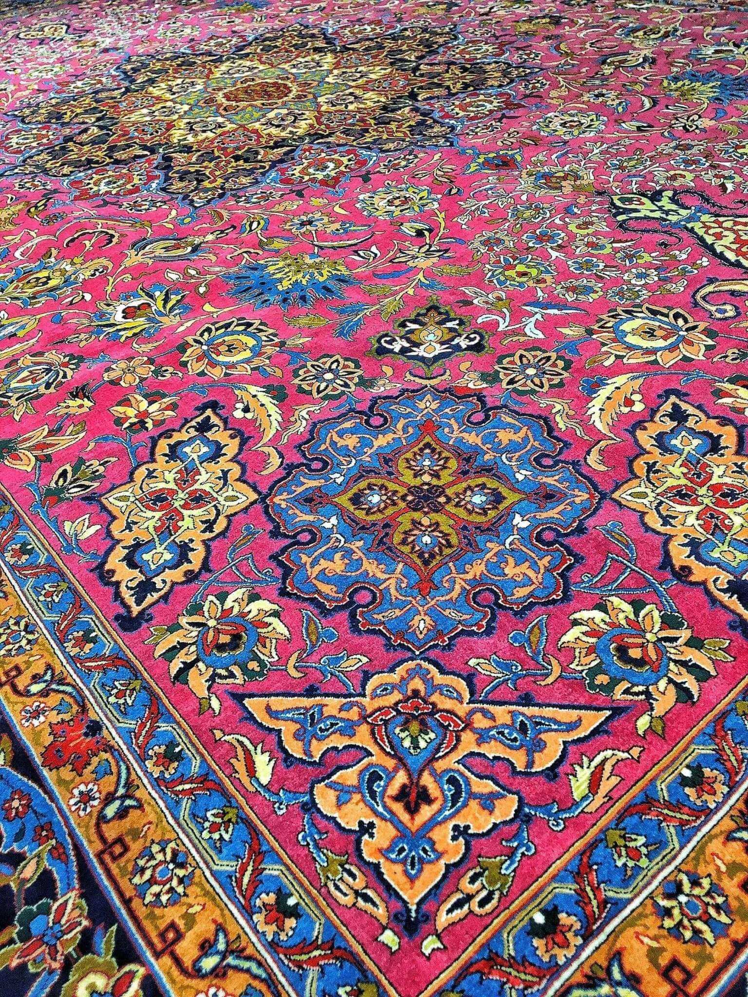 Purple hand-knotted wool rug with a central medallion and ornate border, perfect for adding a touch of elegance to any room.